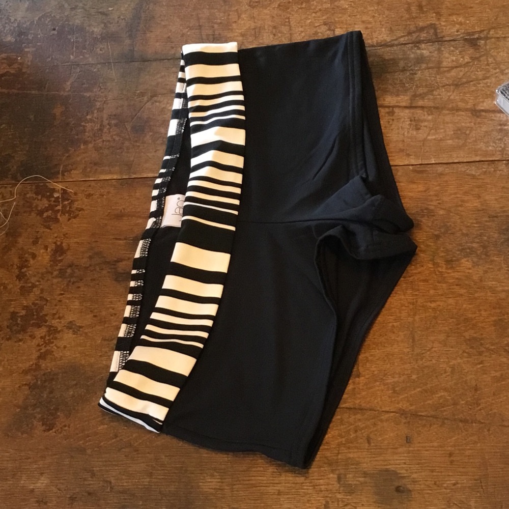 0208 Jag Black Swim Shorts w/ black & white waist band; VGUC size M